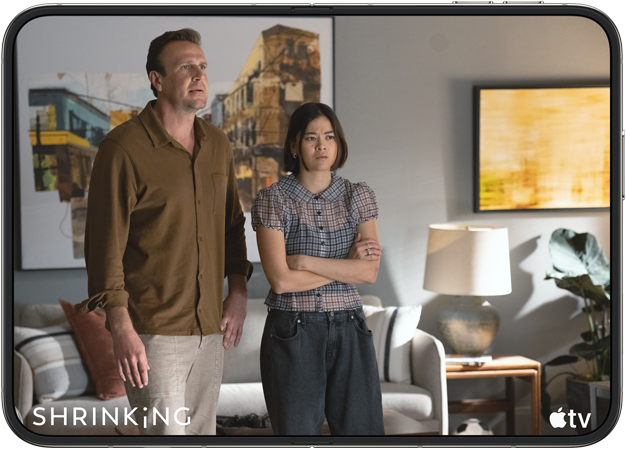 iPhone&nbsp;Duo, opened in horizontal position, Apple&nbsp;TV show “Shrinking” plays on screen